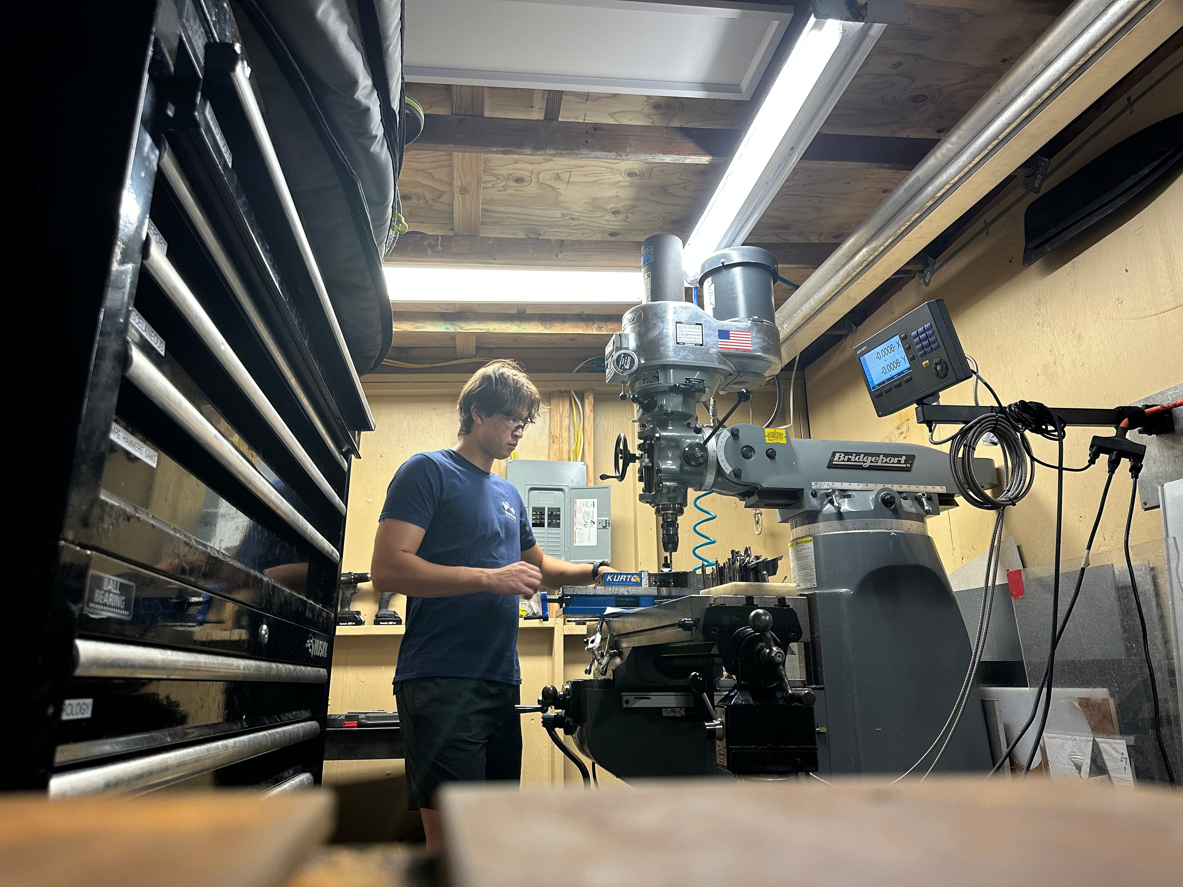 Working on a Bridgeport milling machine at Makai Ocean Engineering